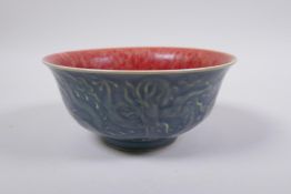 A Chinese porcelain rice bowl with a flambe glazed  interior and blue glazed exterior with