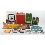Selection of vintage oil cans and signs