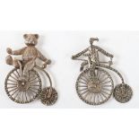 Two silver cycling penny farthing brooches, one with teddy bear, Birmingham 1991, and another stampe