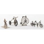 Three 925 silver bikes including a tandem, tricycle and penny farthing on stand, with another penny