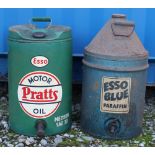 A Pratts Motor oil can and an Esso Blue Paraffin can