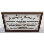 A mirrored sign ‘Antique Dealer Purveyor of Antiques to the Nobility & Gentry Period Furniture, Pain