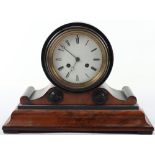 A Regency walnut and ebonised mantle clock