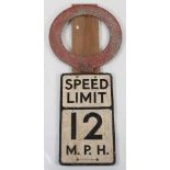 An original vintage aluminium Speed Limit 12M.P.H sign with wood board backing