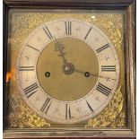 A rare early 18th century four pillar longcase clock, brass and silvered dial signed Edmund M