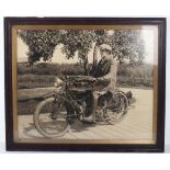 A large original photograph of a gentleman on an Indian motorcycle