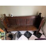 An 18th century oak hall seat / pew