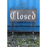 A vintage cast iron 'Closed' sign