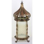 An Art Nouveau brass and glass lantern