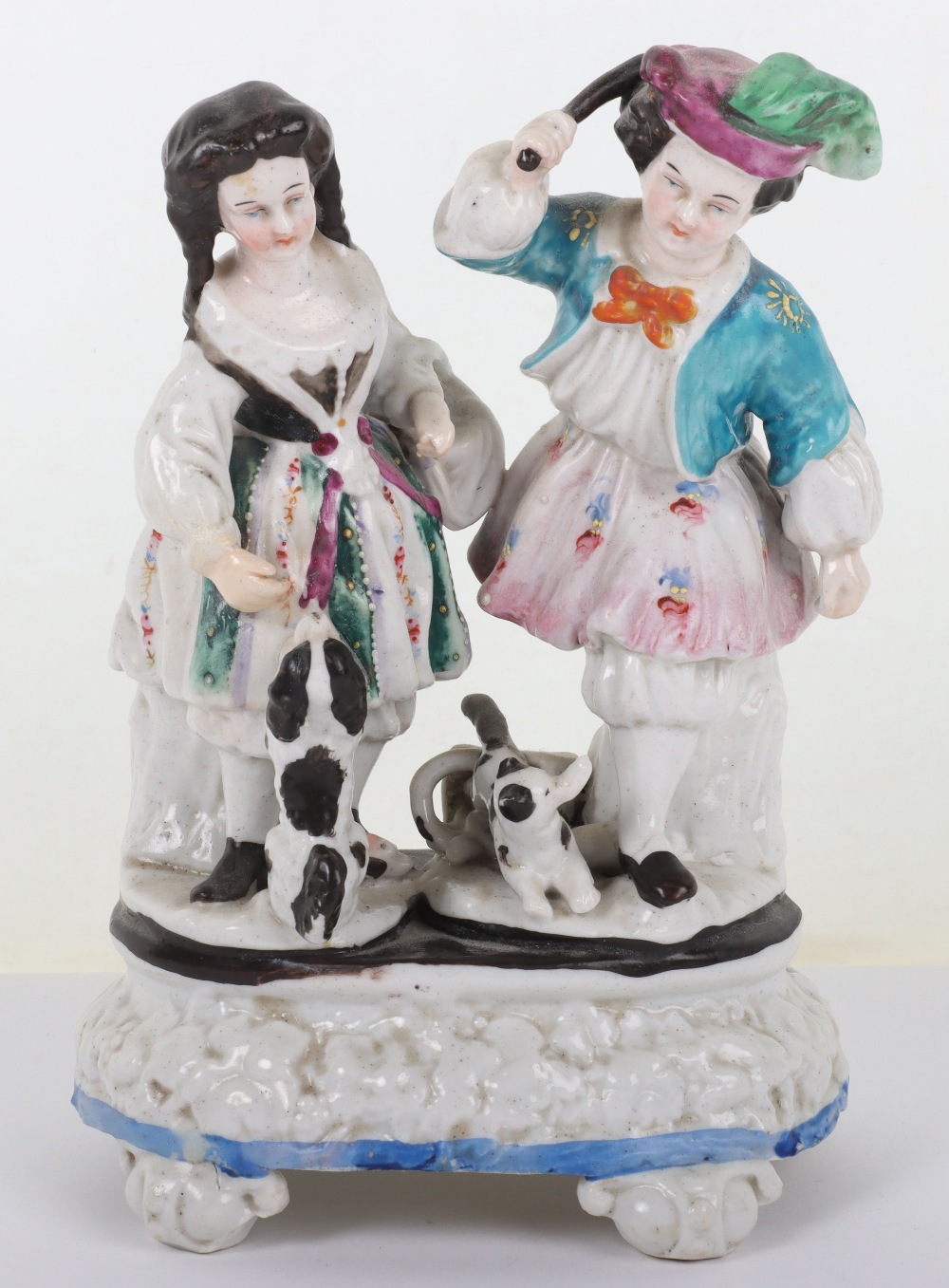 An 18th century porcelain group of man and woman with two dogs