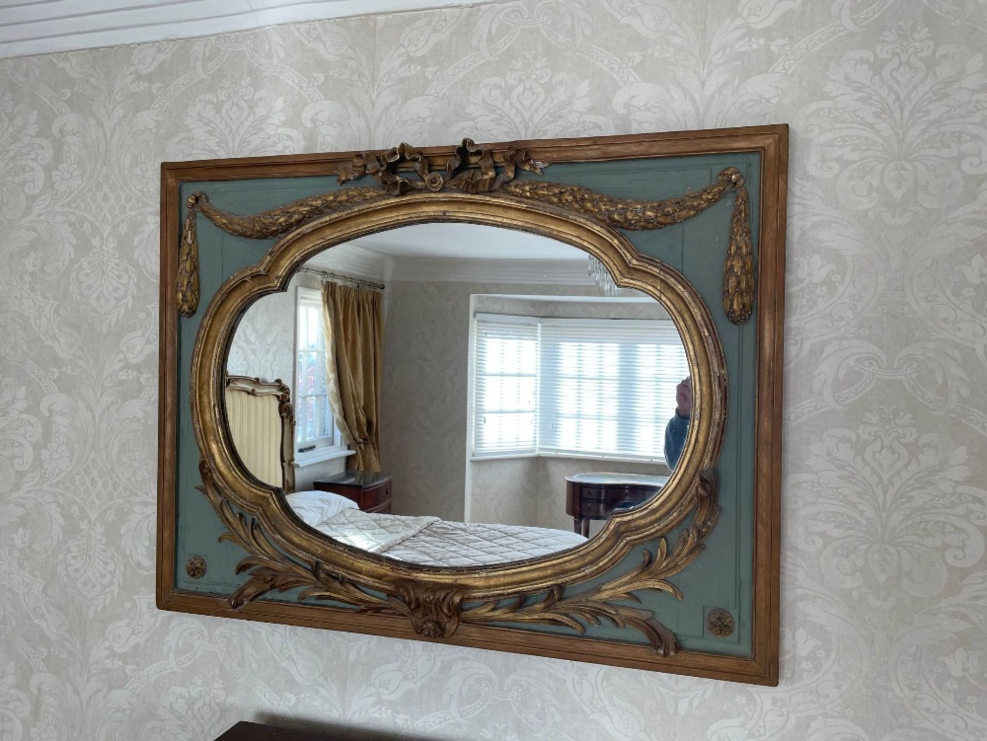 An Italian giltwood and painted mirror