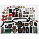 A mixed lot of WWII badges, cloth insignia, some reproduction