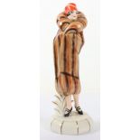 An Art Deco Goebel figurine of a lady in fur coat