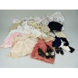 Collection of various dolls dresses and shoes,