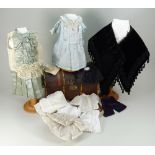 A sweet miniature Edwardian dolls trunk with clothes,