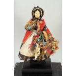 A good early Pedlar doll in glass case, German, mid 19th century ,