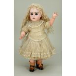 Small size Tete Jumeau bisque head Bebe doll in original clothes, French circa 1885,
