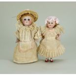 Pair of good all-bisque miniature dolls, German 1890s,