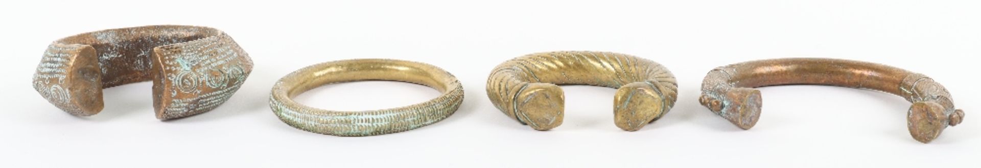 Four 18th century brass and bronze African bangles - Image 2 of 4