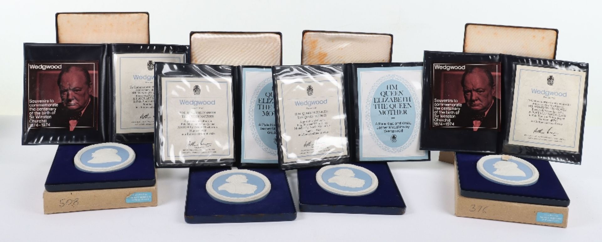 Wedgwood blue and white Jasper portrait medallions, two Churchill and two Queen Mother