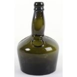 An early 19th century green glass onion bottle