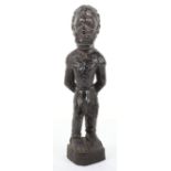 A carve ebony figure of a standing African slave