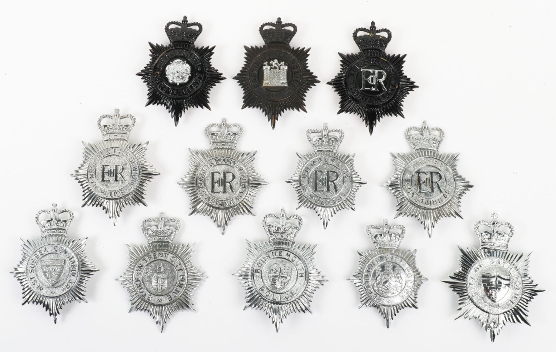 Twelve Obsolete Queens Crown Police Helmet Plates