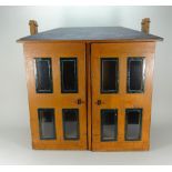 A wooden cupboard style Dolls House, English 19th century,