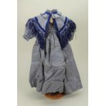 A larger blue silk check dress,