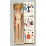 A boxed vintage Mattel Bubble Cut Barbie Platinum doll,