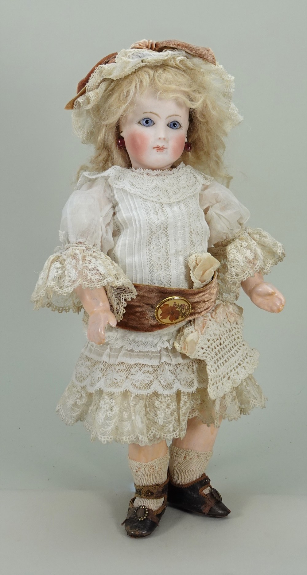 Rare and interesting early bisque head mystery Bebe doll for ‘AU NAIN BLEU’ of Paris, French circa 1