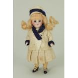Miniature all-bisque doll in original clothes, German circa 1910,