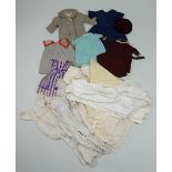 Good selection of dolls clothing,