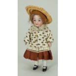 Miniature all-bisque doll in original clothes, German circa 1910,