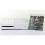 Xbox One white console with games