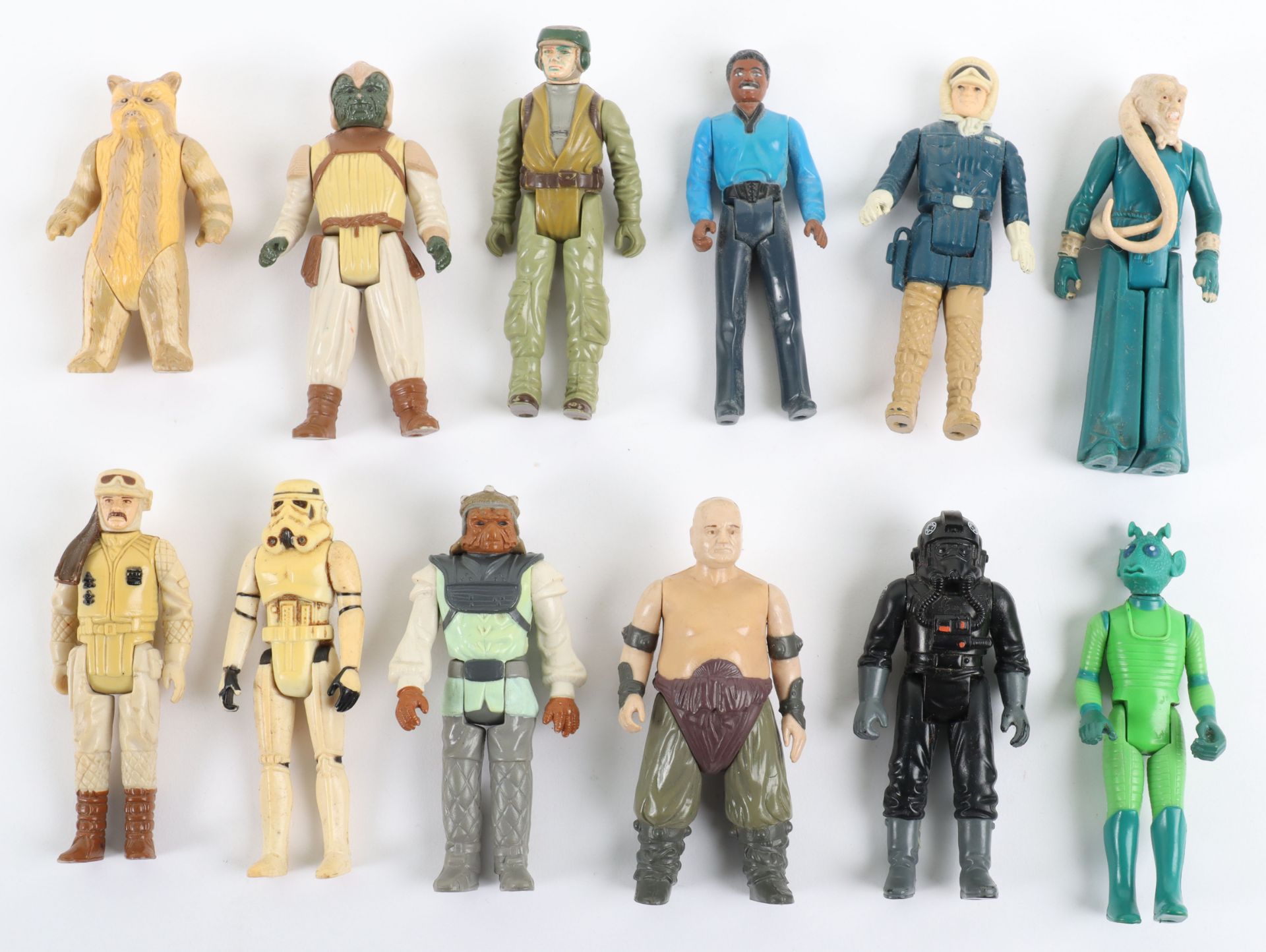 Twelve Vintage Loose Mixed Wave Star Wars Action Figures