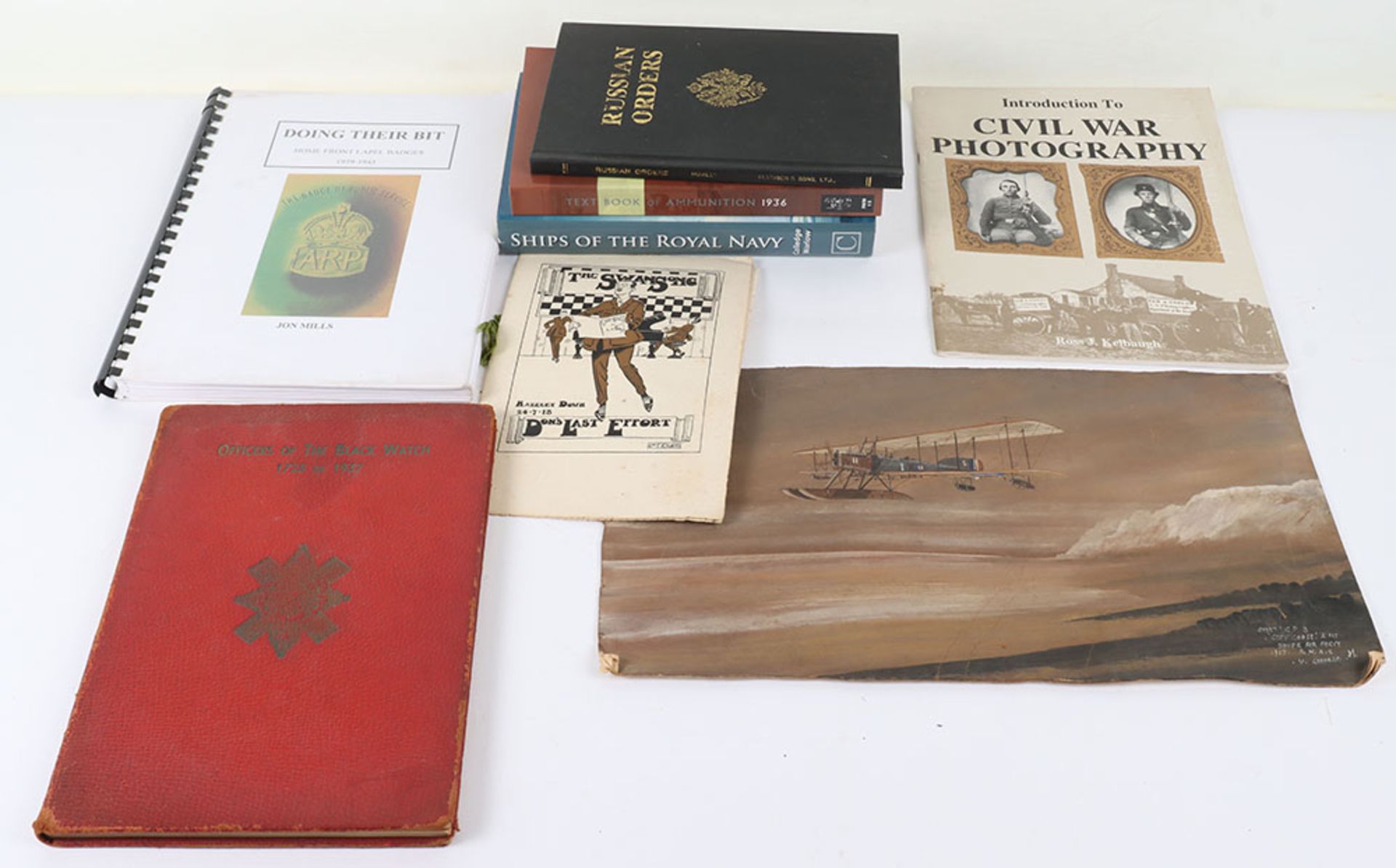 Various military books including Textbook of Ammunition Notified in Army Orders for February 1936