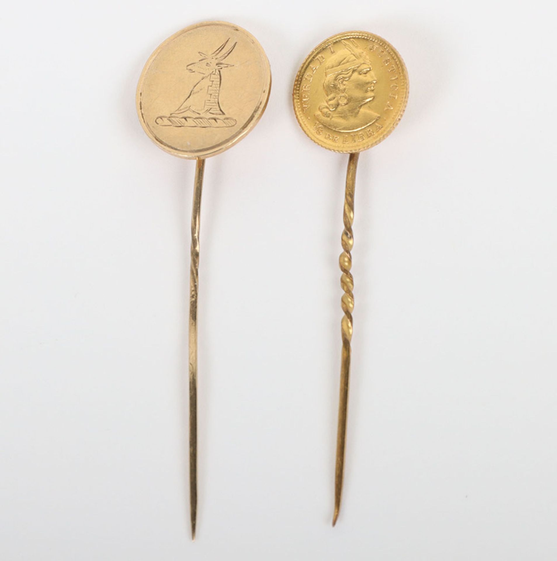 Two gold stick pins including a Peru 1911 1/5 Libra coin (.917) mounted on pin and a 9ct gold herald