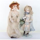 Two character dolls by Rosemary Bradshaw of an Edwardian lady in straw hat, with a Victorian child d