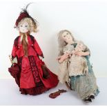 Two character dolls by Rosemary Bradshaw of a Victorian lady in rocking chair with twin babies and a