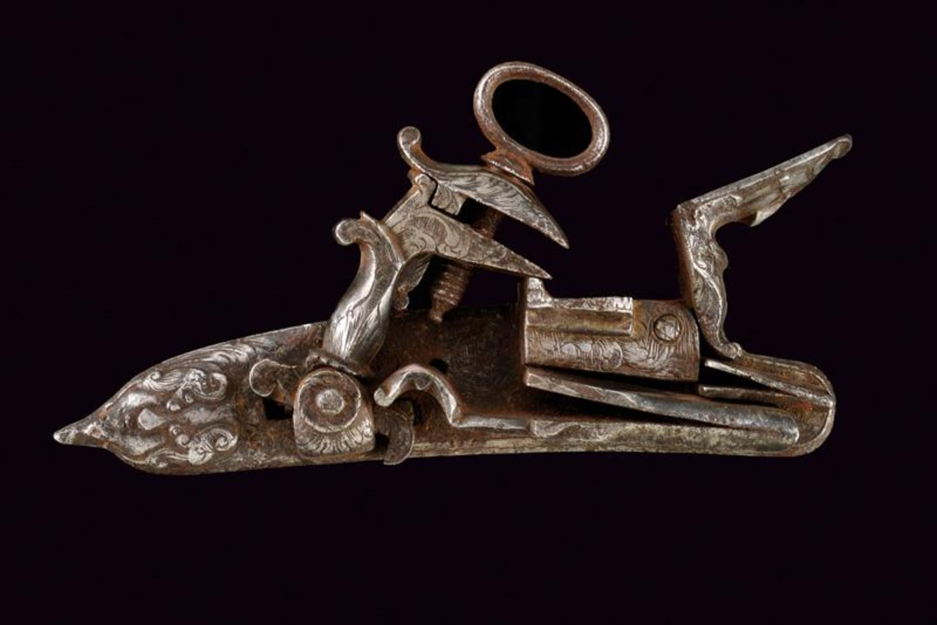 A Roman-style flintlock with masks