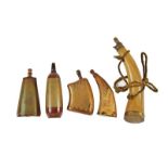 A small collection of five powder flasks in cow horn