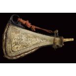 A big and finely decorated horn powderflask