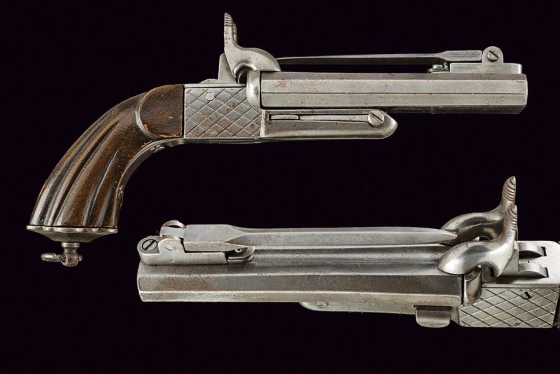 A double-barreled pinfire pistol with bayonet