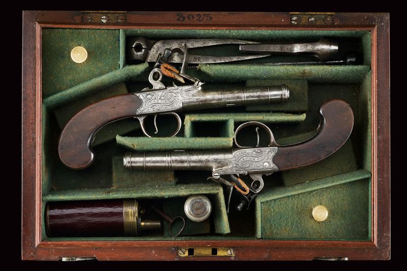 A cased pair of flintlock pocket pistols by T. Staton