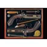 A rare pair of cased double barrelled percussion pistols by Colombo