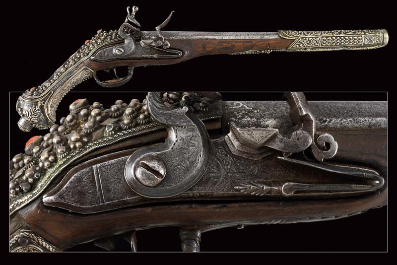 A beautiful silver mounted flintlock pistol in Ali Pasha style