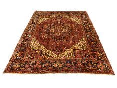 Persian Heriz golden red ground carpet