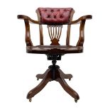 Early 20th century walnut swivel desk elbow chair