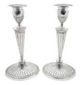 Pair of George III silver Adam style candlesticks